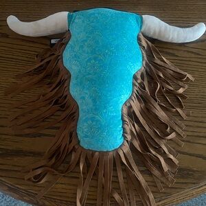 L&B brand longhorn skull decorative pillow. Turquoise face with brown fringe